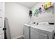 Laundry room featuring side-by-side washer and dryer at 3020 Westgate Park Dr, Loganville, GA 30052