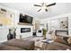 Spacious living room with hardwood floors, a fireplace, and stylish furniture at 3020 Westgate Park Dr, Loganville, GA 30052