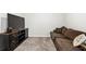Upstairs living room featuring neutral walls and carpet at 3020 Westgate Park Dr, Loganville, GA 30052