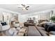 Open-concept living room with a modern design and comfortable seating at 3020 Westgate Park Dr, Loganville, GA 30052