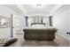Main bedroom with a tray ceiling and ensuite at 3020 Westgate Park Dr, Loganville, GA 30052