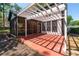 Back patio with screened-in porch and pergola at 4161 Sherwood Oaks Dr, Decatur, GA 30034