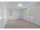 Bright bedroom offers two windows and a neutral palette to create a peaceful retreat at 4161 Sherwood Oaks Dr, Decatur, GA 30034