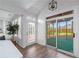 Bright breakfast nook with wood floors, screened porch access, and large windows providing natural light at 4161 Sherwood Oaks Dr, Decatur, GA 30034