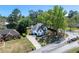 Charming two-story home boasts mature landscaping and a welcoming entrance, nestled in a serene neighborhood at 4161 Sherwood Oaks Dr, Decatur, GA 30034
