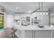 Well-appointed kitchen with an island, barstool seating, stone countertops, and stainless appliances at 4161 Sherwood Oaks Dr, Decatur, GA 30034