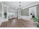 Open-concept living space with hardwood floors, decorative columns and easy access to the kitchen at 4161 Sherwood Oaks Dr, Decatur, GA 30034