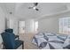 Main bedroom features a tray ceiling, carpeting, ample space, and a glimpse into the ensuite bathroom at 4161 Sherwood Oaks Dr, Decatur, GA 30034