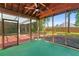 Relaxing screened porch featuring a ceiling fan, backyard access and a wooden frame creating an outdoor living space at 4161 Sherwood Oaks Dr, Decatur, GA 30034