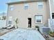 Backyard features a patio with lounge chairs, small plant, hot tub, and access to the property interior at 164 Haven Oak Way, Lawrenceville, GA 30044