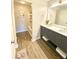 Elegant bathroom with double sink vanity, modern fixtures, and a linen closet at 164 Haven Oak Way, Lawrenceville, GA 30044