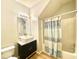 A spacious bathroom with modern fixtures, including a framed mirror and sleek vanity at 164 Haven Oak Way, Lawrenceville, GA 30044