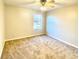 Cozy bedroom with neutral walls, a ceiling fan, and a bright window at 164 Haven Oak Way, Lawrenceville, GA 30044