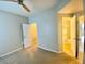 This bedroom is well lit with neutral paint and ceiling fan at 164 Haven Oak Way, Lawrenceville, GA 30044