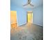 Inviting carpeted bedroom features a modern ceiling fan, natural light, and closet, enhancing the comfort of the house at 164 Haven Oak Way, Lawrenceville, GA 30044
