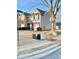 Townhome showcasing a well-maintained lawn, brick accents, and an attached garage at 164 Haven Oak Way, Lawrenceville, GA 30044
