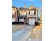 Charming two-story townhome with a driveway and attached garage at 164 Haven Oak Way, Lawrenceville, GA 30044