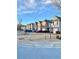 Row of townhomes featuring brick and siding exteriors with attached garages at 164 Haven Oak Way, Lawrenceville, GA 30044
