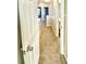 Hallway featuring neutral paint, and carpet that provides access to various rooms, enhancing the functionality of the house at 164 Haven Oak Way, Lawrenceville, GA 30044