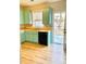 Efficient kitchen with wooden floor, complete with modern appliances and lots of counterspace, making it ready for immediate use at 164 Haven Oak Way, Lawrenceville, GA 30044