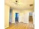 A well-lit living room with hard wood floors and staircase at 164 Haven Oak Way, Lawrenceville, GA 30044