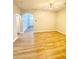 Open-concept living room featuring light hardwood floors and lots of space at 164 Haven Oak Way, Lawrenceville, GA 30044
