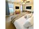 Comfortable main bedroom with plush bedding, ceiling fan, and great natural light at 164 Haven Oak Way, Lawrenceville, GA 30044