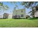 Rear exterior of the home with a deck overlooking the spacious lawn at 4032 Robin Cir, College Park, GA 30349