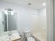 Bright bathroom featuring a bathtub, toilet, and a large mirror above the sink at 4032 Robin Cir, College Park, GA 30349