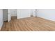 Bedroom with seamless flooring, neutral paint, and doors leading to other rooms at 4032 Robin Cir, College Park, GA 30349