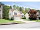 Attractive two-story home boasting stone details, a two-car garage, and lush landscaping at 4032 Robin Cir, College Park, GA 30349