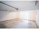 Spacious garage with a rolling garage door and utility door, ready for your vehicles at 4032 Robin Cir, College Park, GA 30349