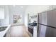 Bright kitchen features stainless steel appliances, light countertops and a large window at 4032 Robin Cir, College Park, GA 30349