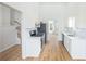 Open kitchen features stainless steel appliances, light countertops and seamless flooring at 4032 Robin Cir, College Park, GA 30349