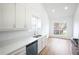 Modern kitchen with white cabinets, stone countertops, and stainless steel appliances at 4032 Robin Cir, College Park, GA 30349