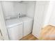 Laundry room featuring a white washer and dryer with shelving at 4032 Robin Cir, College Park, GA 30349