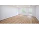 Living room features seamless flooring, bright natural light, and access to the backyard at 4032 Robin Cir, College Park, GA 30349