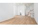 Open living room with wood floors, a staircase, and ample space for entertaining at 4032 Robin Cir, College Park, GA 30349