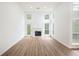 Spacious living room with wood floors, a fireplace, and plenty of natural light at 4032 Robin Cir, College Park, GA 30349