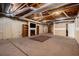 Unfinished basement with exposed ductwork, a fireplace, and concrete floors ready for customization at 5000 Bainbridge Sw Ct, Lilburn, GA 30047