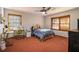 Comfortable bedroom featuring a desk and a window with natural light at 5000 Bainbridge Sw Ct, Lilburn, GA 30047