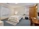 Bedroom with modern decor, decorative rug, and bright windows at 5000 Bainbridge Sw Ct, Lilburn, GA 30047