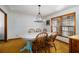 Traditional dining room with an oval table, wooden chairs, and a chandelier at 5000 Bainbridge Sw Ct, Lilburn, GA 30047