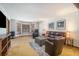 A well-lit living room with cozy seating, a decorative rug, and large bay windows at 5000 Bainbridge Sw Ct, Lilburn, GA 30047