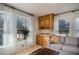 Cozy living space with large windows bringing in natural light and featuring a seating area with a sofa at 5000 Bainbridge Sw Ct, Lilburn, GA 30047