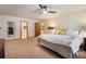 Spacious main bedroom with neutral carpet, ceiling fan, and ample natural light at 5000 Bainbridge Sw Ct, Lilburn, GA 30047