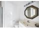 Small bathroom with white tile walls, a toilet, and sink vanity at 705 W Ponce De Leon Ave, Decatur, GA 30030