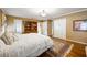 Bedroom with hardwood floors, built in storage, bookshelves, a large rug, and natural light at 705 W Ponce De Leon Ave, Decatur, GA 30030