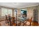 Bright dining room with views to living room and backyard at 705 W Ponce De Leon Ave, Decatur, GA 30030