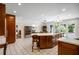Open-concept kitchen with an island, stainless steel appliances, and a breakfast bar at 705 W Ponce De Leon Ave, Decatur, GA 30030
